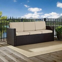 Palm Harbor Outdoor Wicker Sofa In Brown With Sand Cushions - Crosley -Crosley shop GUEST 88c4f0eb 67e9 45d8 965a 78f4e075bc83